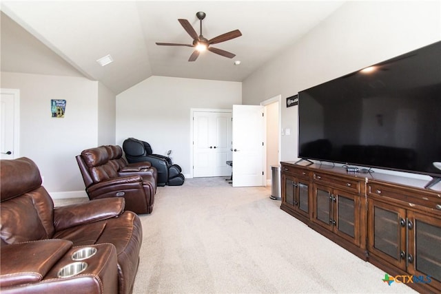 carpeted living room featuring ceiling fan and lofted ceiling