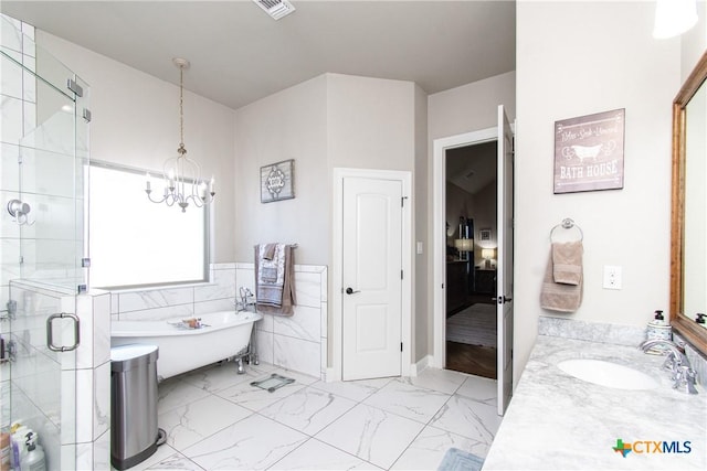 bathroom with vanity, shower with separate bathtub, and an inviting chandelier