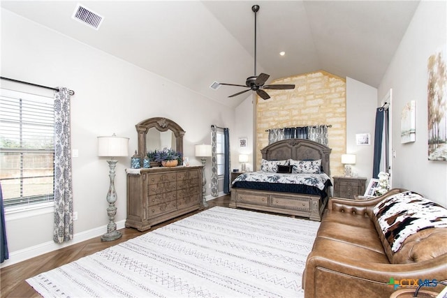 bedroom featuring hardwood / wood-style floors, ceiling fan, and vaulted ceiling