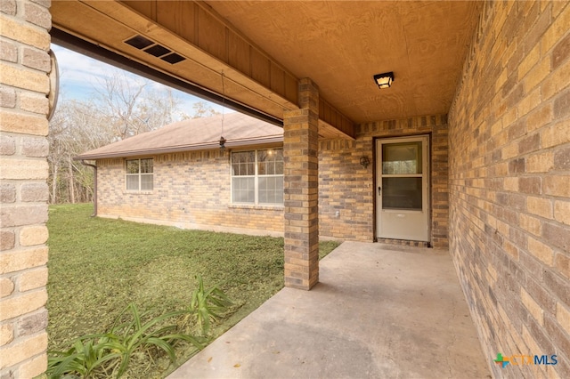 property entrance with a patio area