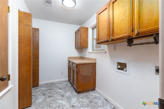 laundry area featuring cabinets and washer hookup