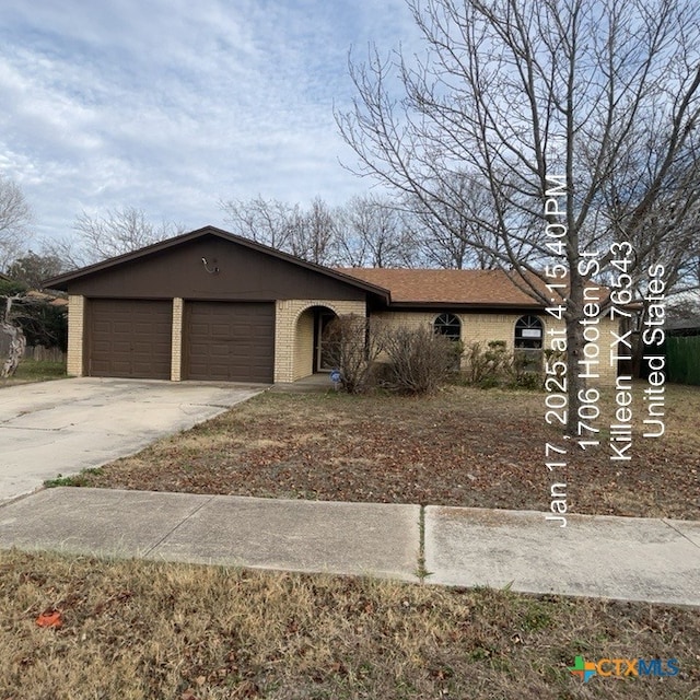 ranch-style house featuring a garage