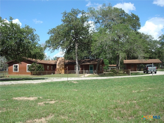 single story home with a front yard