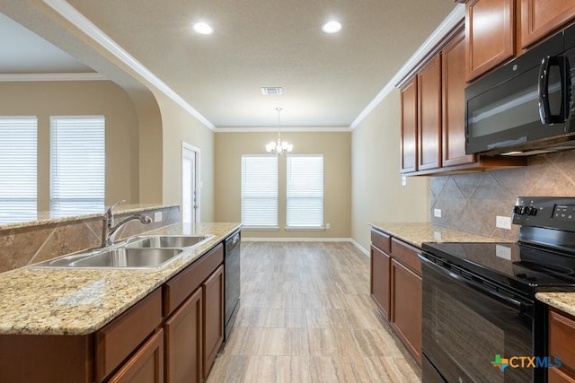 kitchen featuring decorative light fixtures, sink, backsplash, black appliances, and crown molding