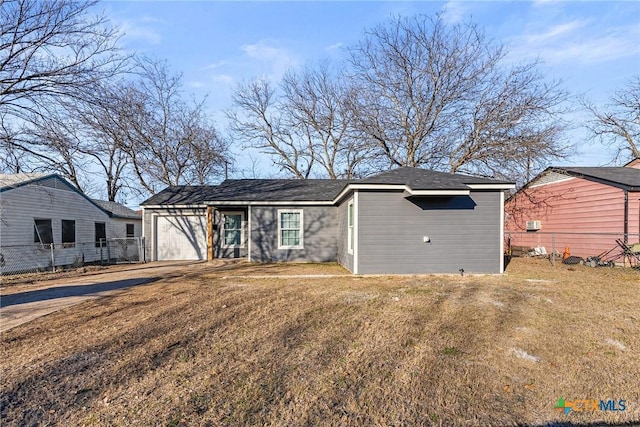 ranch-style house with a garage and a front lawn