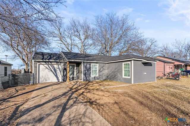 single story home with a garage and a front yard