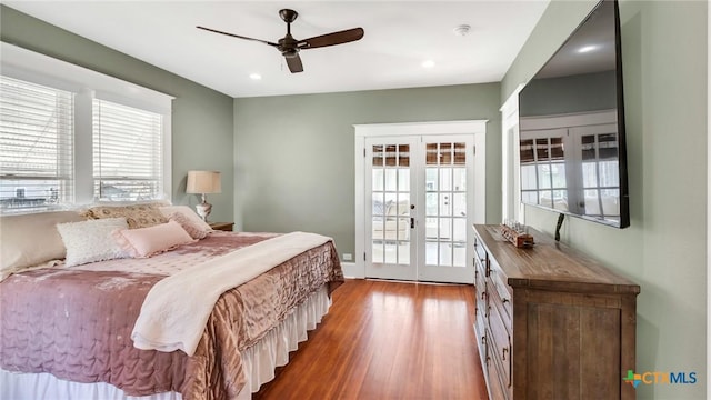 bedroom with access to outside, ceiling fan, french doors, and multiple windows