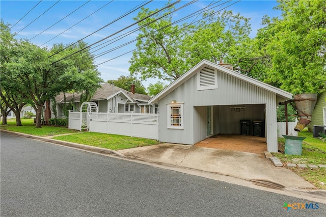 view of front of home with a carport