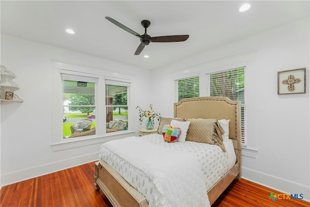 bedroom featuring ceiling fan and dark hardwood / wood-style floors