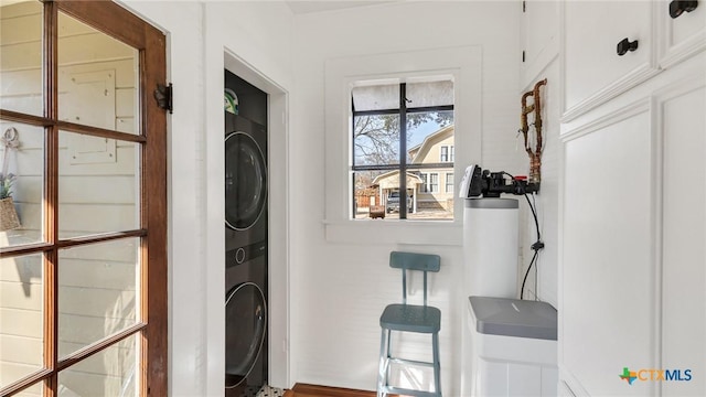 washroom featuring stacked washer and dryer