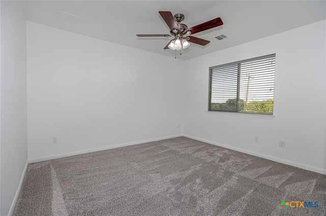 spare room featuring ceiling fan and carpet floors