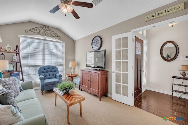 living room featuring french doors, ceiling fan, and lofted ceiling