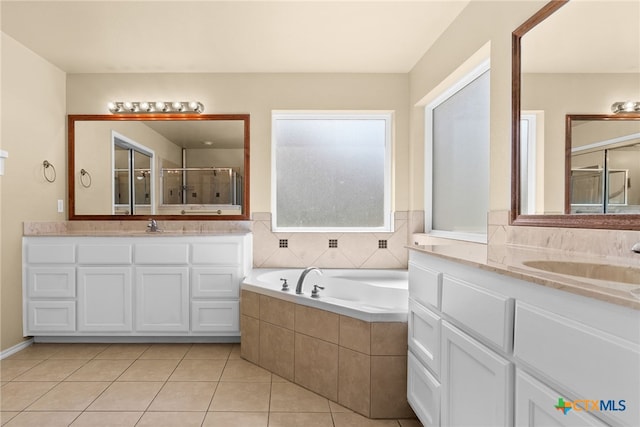 bathroom featuring vanity, shower with separate bathtub, and tile patterned flooring