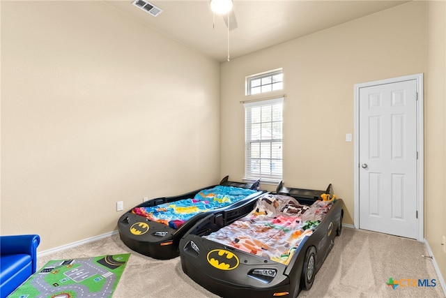 bedroom featuring light colored carpet and ceiling fan