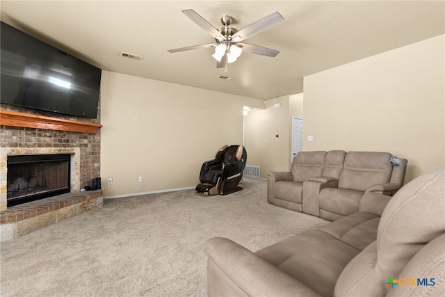 living room with carpet flooring, a fireplace, and ceiling fan