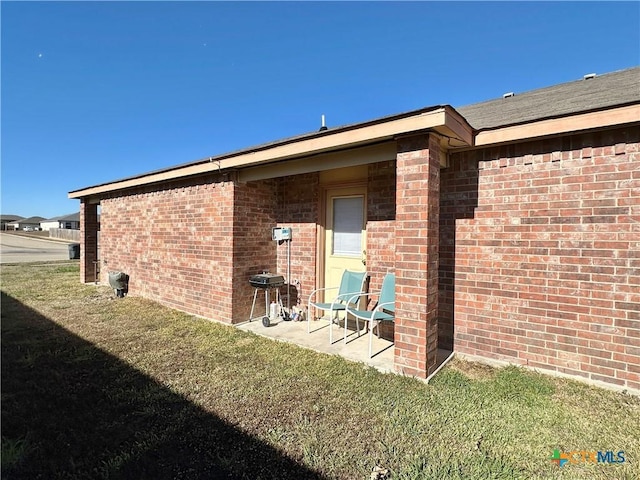 rear view of property with a yard