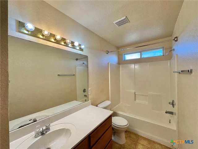 full bathroom with vanity, a textured ceiling, toilet, and shower / washtub combination