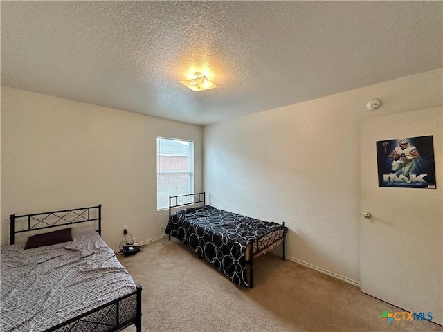 carpeted bedroom with a textured ceiling