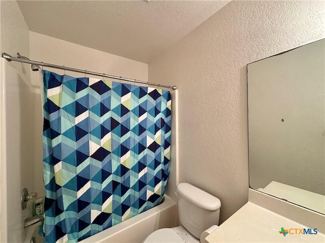 full bathroom with vanity, shower / bath combo, a textured ceiling, and toilet