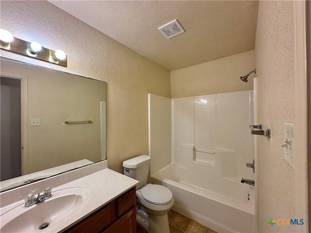 full bathroom with vanity, a textured ceiling, shower / tub combination, tile patterned flooring, and toilet