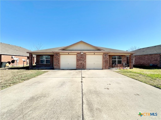 ranch-style house featuring a front lawn and a garage