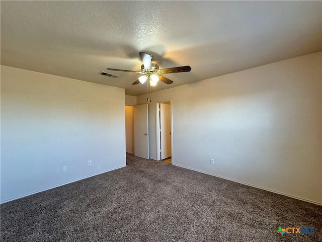 spare room featuring carpet flooring, a textured ceiling, and ceiling fan