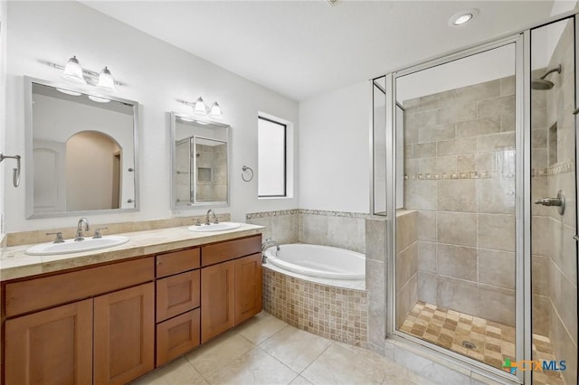 14424 Tuscola Cir, Austin, TX 78734 - full bathroom with a shower stall, double vanity, a garden tub, and tile patterned floors