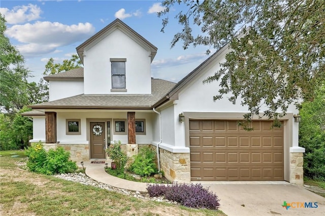 14424 Tuscola Cir, Austin, TX 78734 - view of front of home with stucco siding, stone siding, roof with shingles, driveway, and an attached garage
