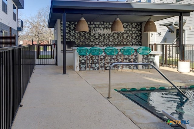 view of patio / terrace with exterior bar