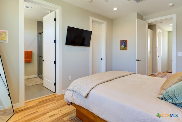 bedroom featuring light wood-type flooring