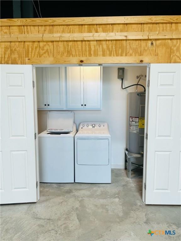 305 W Denver Ave, Seadrift, TX 77983 - washroom featuring cabinet space, water heater, and washer and dryer