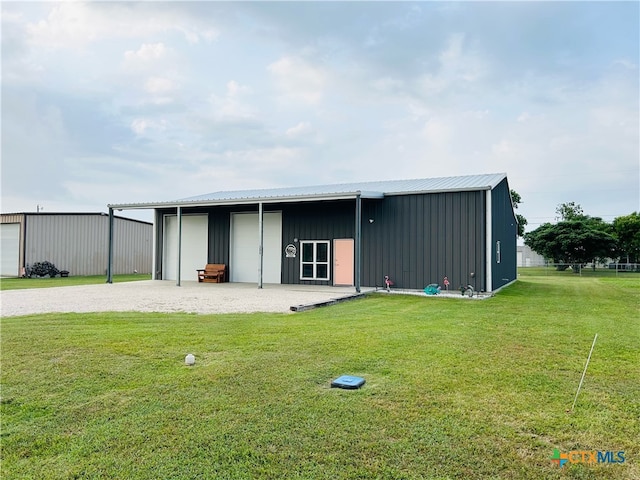 view of outdoor structure featuring a yard