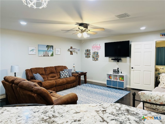 living room with hardwood / wood-style floors and ceiling fan