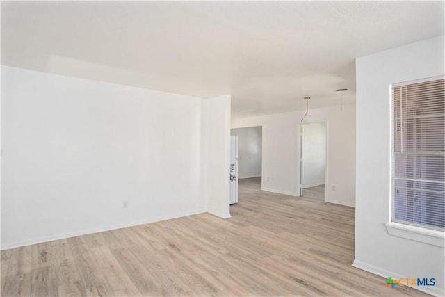 empty room featuring light hardwood / wood-style floors