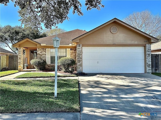 single story home with a garage, brick siding, fence, and driveway