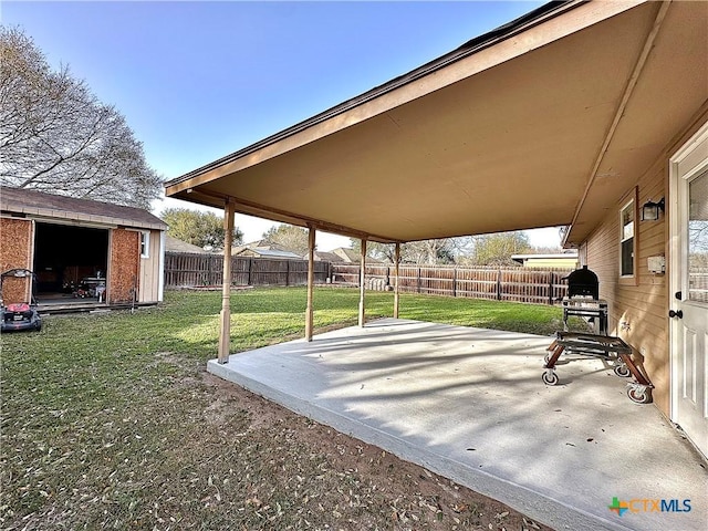 view of patio with a fenced backyard and an outbuilding