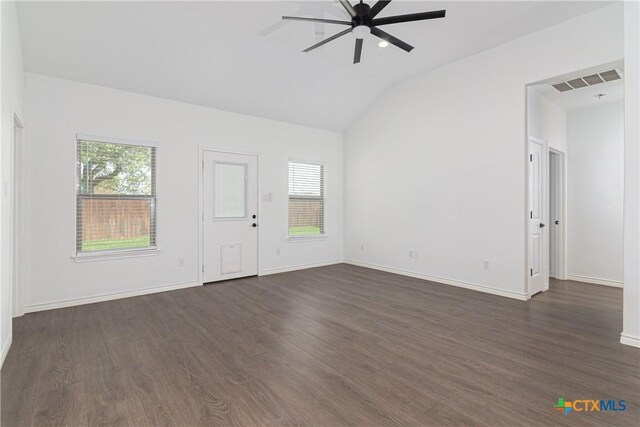168 Navarro Xing, Seguin, TX 78155 - unfurnished living room featuring lofted ceiling, ceiling fan, dark wood-style flooring, and baseboards
