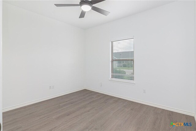 168 Navarro Xing, Seguin, TX 78155 - empty room with wood finished floors, ceiling fan, and baseboards