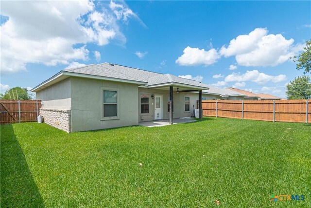 168 Navarro Xing, Seguin, TX 78155 - back of property featuring a patio area, stucco siding, a shingled roof, and a ceiling fan