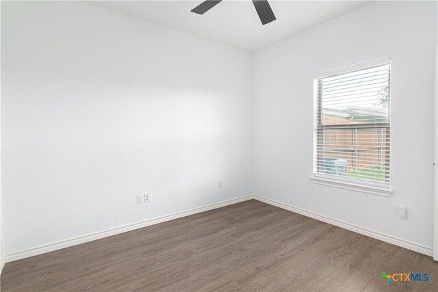 168 Navarro Xing, Seguin, TX 78155 - empty room with wood finished floors, plenty of natural light, and baseboards
