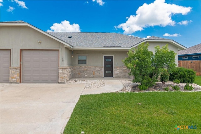 168 Navarro Xing, Seguin, TX 78155 - view of front facade featuring stone siding, concrete driveway, an attached garage, stucco siding, and a shingled roof