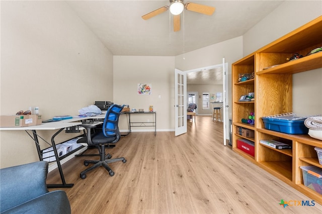 office featuring ceiling fan, light wood-type flooring, and french doors