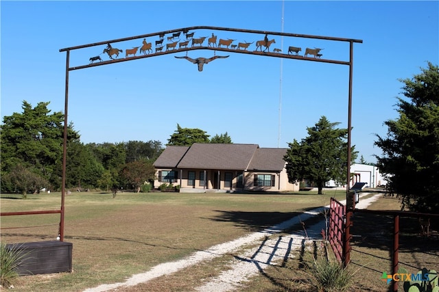 view of home's community with a yard