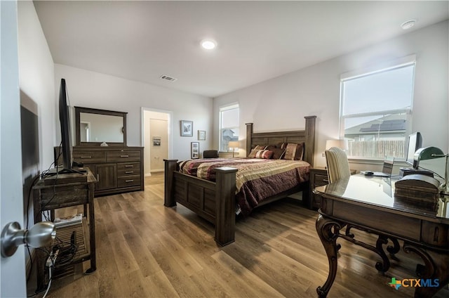 630 Golden Grove Pkwy, San Marcos, TX 78666 - bedroom with visible vents and wood finished floors