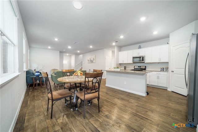 630 Golden Grove Pkwy, San Marcos, TX 78666 - dining space featuring recessed lighting, stairway, baseboards, and dark wood-style floors