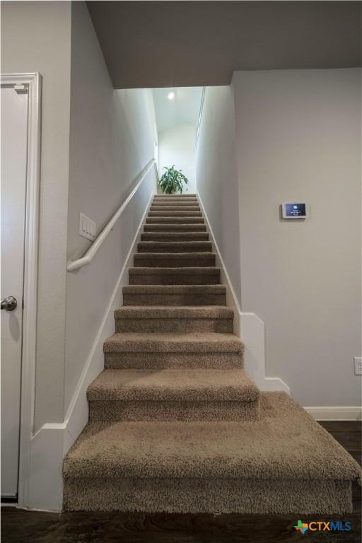 630 Golden Grove Pkwy, San Marcos, TX 78666 - stairs featuring baseboards