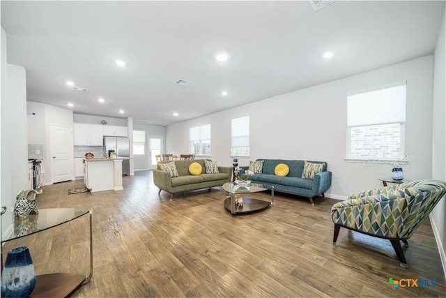 630 Golden Grove Pkwy, San Marcos, TX 78666 - living room featuring recessed lighting, wood finished floors, visible vents, and baseboards