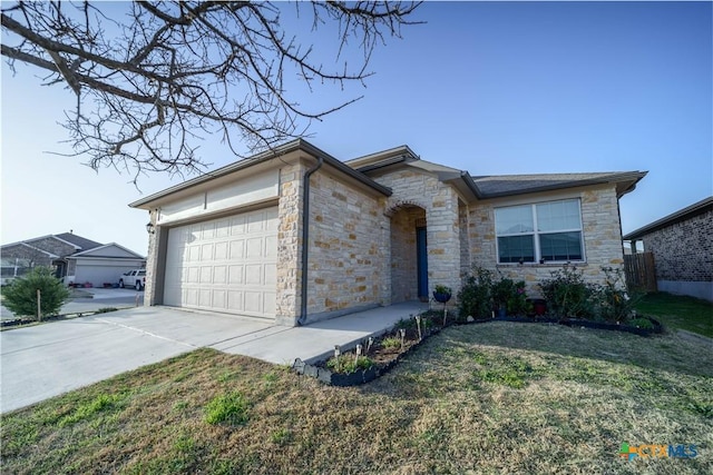 630 Golden Grove Pkwy, San Marcos, TX 78666 - single story home with a front yard, an attached garage, stone siding, and driveway