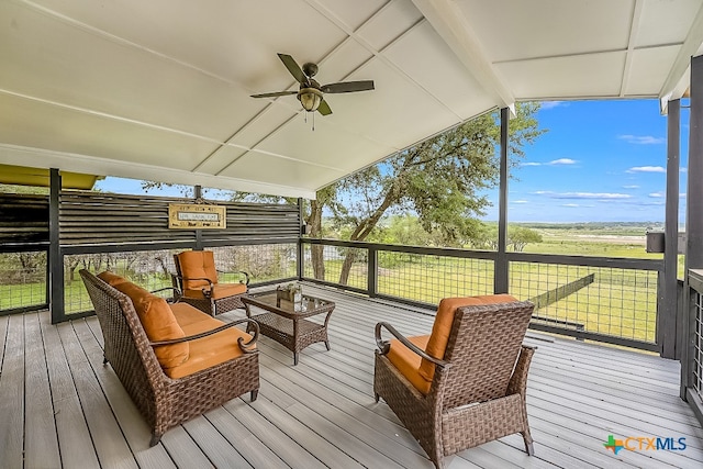 wooden terrace featuring ceiling fan and an outdoor living space