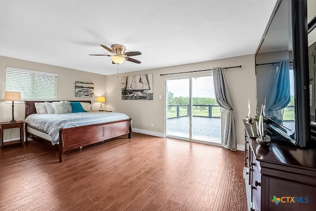 bedroom with baseboards, ceiling fan, access to exterior, and wood finished floors